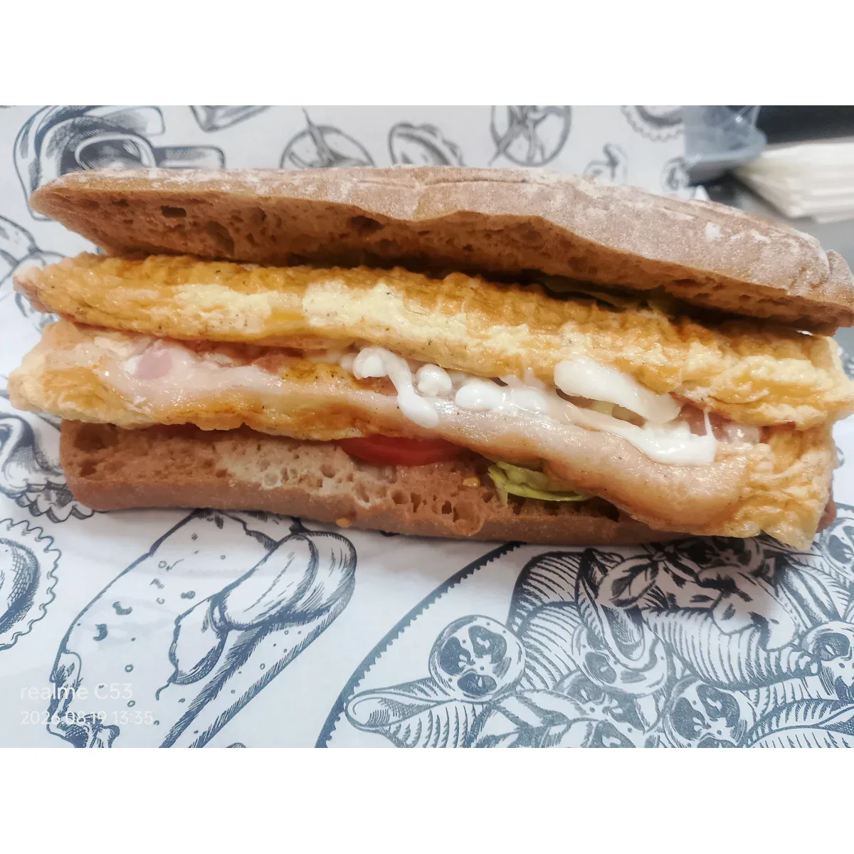 Sandwich with omelet and bacon from the menu of The Sandwich